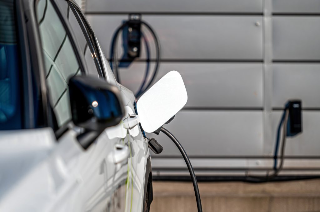 the-electric-car-charger-plugged-in-to-the-socket-2025-03-14-15-33-41-utc